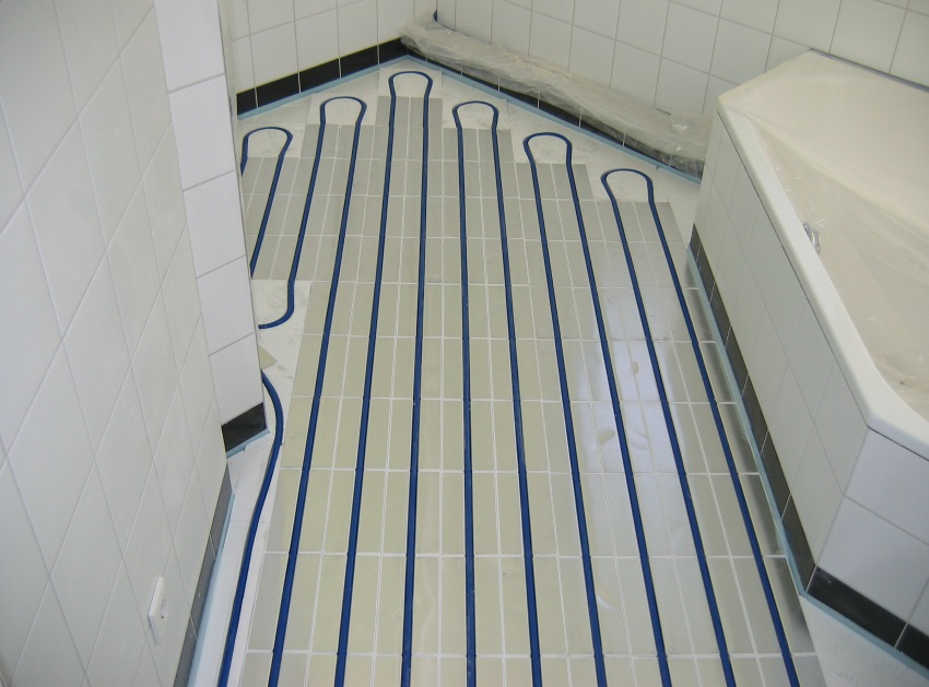 Comment fonctionne un plancher chauffant hydraulique ultra-mince à Genève | Guide complet 2025